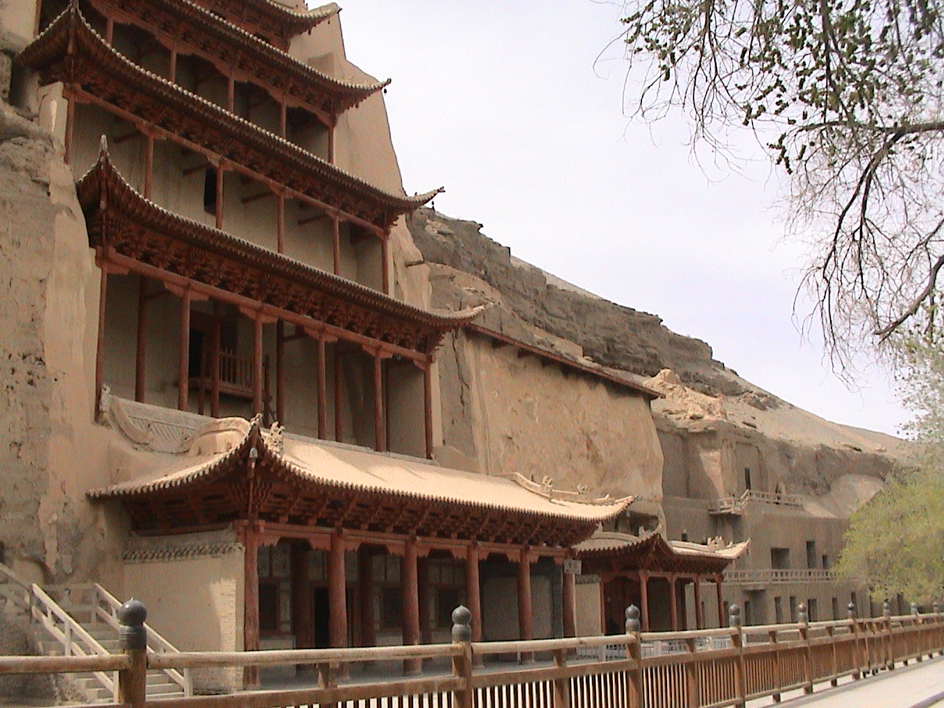 The multi-storey exterior of Mogao Cave 96 rises against the carved cliff at Dunhuang.