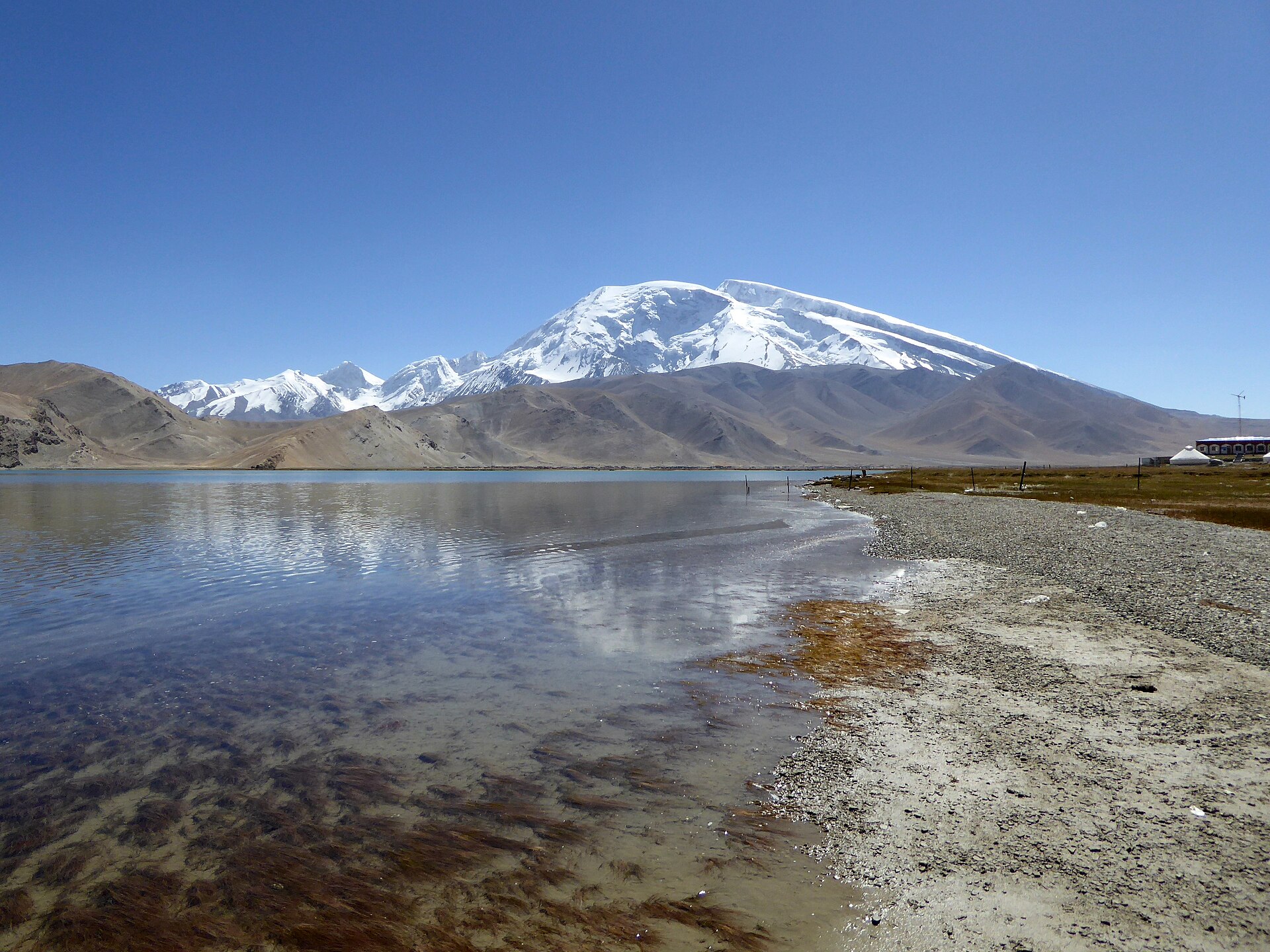 Karakul Lake lies below the snow-covered Muztagh Ata massif in Xinjiang.