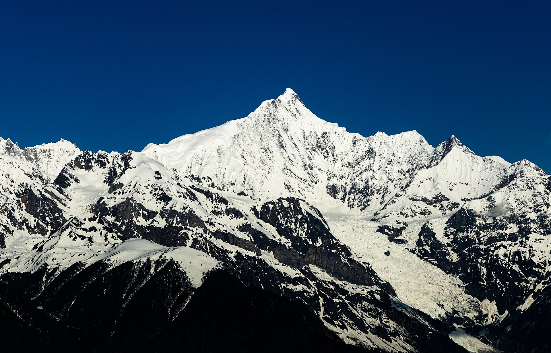 The eastern face of Kawagarbo in the Meili Snow Mountains seen from Feilai Temple Viewing Platform on a clear May morning.